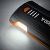 Close-up of a black and orange power bank with an illuminated light. Anteprima dell’immagine prodotto