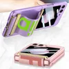 Two phone cases are shown, one purple and one pink, with a strap and gold accents. Produktbild-Vorschau