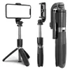 A product shot of a black selfie stick and tripod with a smartphone attached, shown in three different configurations against a white background. Náhled obrázku produktu
