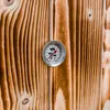 A close-up of a thermometer on a wooden surface. Náhled obrázku produktu