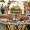 A wedding ceremony in a garden setting. Náhľad obrázku produktu
