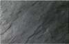 A close-up, overhead view of a slate-like textured surface. Anteprima dell’immagine prodotto