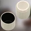 Two views of a white ceramic planter with a textured exterior and a black interior. Náhled obrázku produktu