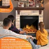 A family is sitting on the floor in front of an electric fireplace, enjoying the warmth and ambiance. Produktbild-Vorschau
