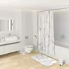 A clean, modern bathroom with a toilet, sink, bathtub, and shower curtain. Produktbild-Vorschau