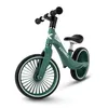 A green balance bike on a white background. Voir les images du produit
