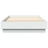 A white bed frame with wooden slats, shown from the side against a white background. Produktbild-Vorschau