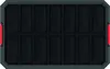 A top-down view of an empty black tool box with red handles. Voir les images du produit