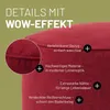 Close-up of a red pouf with text overlays highlighting its features. Produktbild-Vorschau
