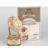 A 3D wooden puzzle gramophone and its packaging are displayed against a white background. Podgląd zdjęcia produktu