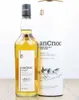 A bottle of An Cnoc 12 Years Old Highland Single Malt Scotch Whisky and its cylindrical packaging. Produktbild-Vorschau