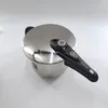 A stainless steel pressure cooker with a black handle is shown against a white background. Podgląd zdjęcia produktu