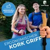 A man and a woman hiking in a forest, holding trekking poles. Voir les images du produit
