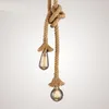 A close-up studio shot of a rustic pendant light fixture. Produktbild-Vorschau