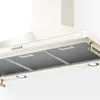 A close-up view of a cream-colored kitchen range hood. Produktbild-Vorschau