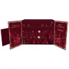An open advent calendar with numbered doors, decorated with a festive forest theme. Produktbild-Vorschau