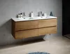 A modern bathroom vanity with double sinks and wooden drawers mounted on a concrete wall. Voir les images du produit