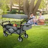 A family is having a picnic in a park, with a HAUKI wagon filled with picnic items in the foreground. Náhled obrázku produktu