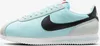 A side view of a single Nike Cortez sneaker.