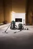 Two wet/dry vacuum cleaners are set up in a room with a fireplace. Produktbild-Vorschau