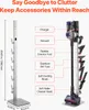 A vacuum cleaner stand with various accessories and a vacuum cleaner displayed. Produktbild-Vorschau