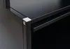 A close-up view of the corner of a black cabinet or shelf unit, showing a white corner protector and a metal shelf. Anteprima dell’immagine prodotto