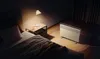 A bedroom scene at night with a heater warming the room. Produktbild-Vorschau