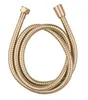 A coiled gold-colored shower hose with brass fittings on a white background. Produktbild-Vorschau