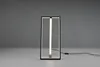 A modern LED table lamp with a rectangular frame and a central light tube, placed on a light gray surface against a gray background. Náhľad obrázku produktu