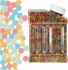 A clear product shot of colorful gel beads in a clear plastic container, with loose beads scattered to the left. Náhled obrázku produktu
