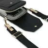 A black crossbody purse bag is shown with its strap detached. Anteprima dell’immagine prodotto
