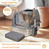 A cat litter box with a cat inside, placed on a wooden floor next to a potted plant. Náhľad obrázku produktu