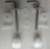 A set of toilet seat hinges and mounting hardware. Podgląd zdjęcia produktu