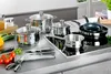 A collection of stainless steel cookware and kitchen utensils arranged on a countertop. Produktbild-Vorschau