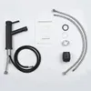 A black faucet and its accessories are laid out on a white background. Anteprima dell’immagine prodotto
