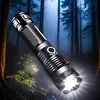 A flashlight is shown in a dark, wooded environment with rain falling. Anteprima dell’immagine prodotto