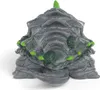 A toy figurine of a creature with a rocky shell and green accents. Anteprima dell’immagine prodotto