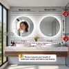 A modern bathroom vanity with two round LED mirrors above. Anteprima dell’immagine prodotto