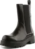 A black leather Chelsea boot with a thick sole is shown against a white background. Anteprima dell’immagine prodotto