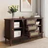 A dark wood sideboard with cane-front drawers and shelves, decorated with a vase of flowers and books. Anteprima dell’immagine prodotto