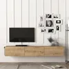 A modern living room setup with a wall-mounted TV and entertainment unit. Anteprima dell’immagine prodotto
