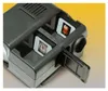 A close-up, angled view of a Kaiser Diascop 50 N 2015 slide projector, loaded with slides. Podgląd zdjęcia produktu