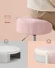 A close-up of a pink velvet stool with diagrams showing its dimensions and internal padding. Náhled obrázku produktu