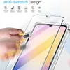A hand is using a utility knife to demonstrate the scratch resistance of a screen protector placed on a smartphone. Produktbild-Vorschau