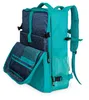 A teal backpack with blue patterned compartments is shown against a white background. The main compartment is open, revealing internal pockets. Podgląd zdjęcia produktu