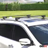A white car with black roof racks installed, parked outdoors on a grassy area with a hedge in the background. Podgląd zdjęcia produktu