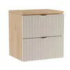 A product shot of a two-drawer cabinet with a wood-effect top and sides, and fluted beige drawer fronts with gold handles, set against a white background. Podgląd zdjęcia produktu
