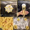 A collage of images showing a Philips pasta maker, fresh pasta being made, and finished pasta nests. Podgląd zdjęcia produktu