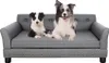 Two dogs are lying on a gray pet sofa. Voir les images du produit