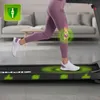 A person running on a treadmill in a home setting, with graphics highlighting knee joint support. Produktbild-Vorschau